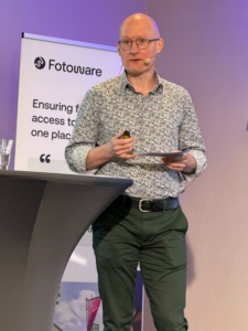 IPTC Managing Director Brendan Quinn speaking at the Fotoware Reimagining DAM conference in Munich, March 2026.